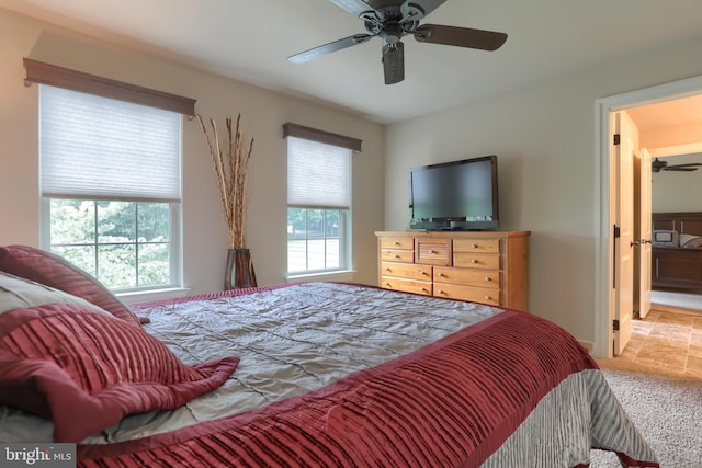 carpeted bedroom with a ceiling fan