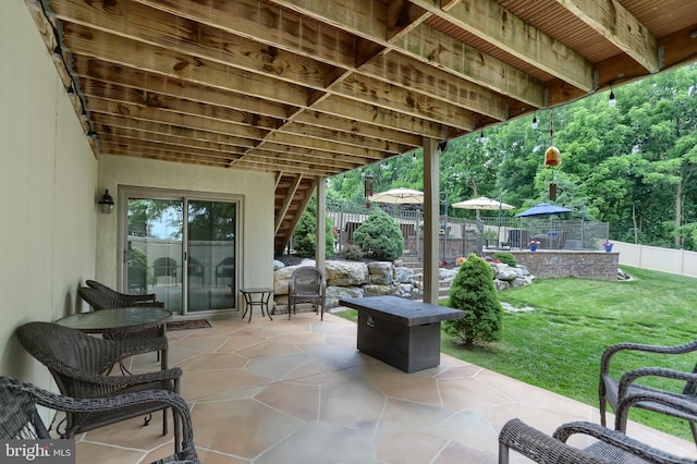 view of patio with stairway and a fenced backyard