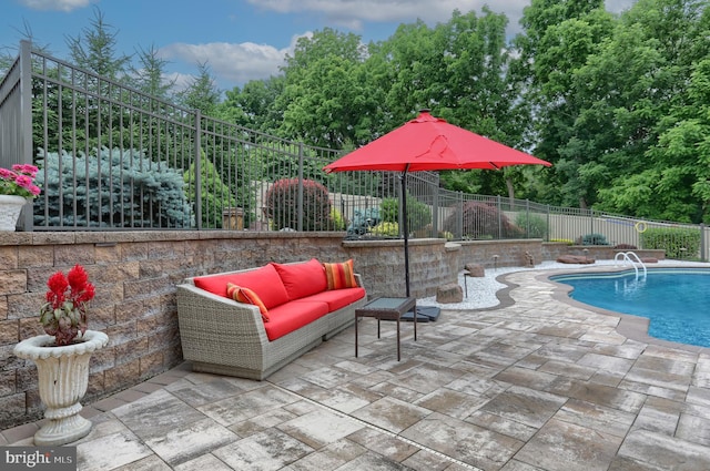 view of swimming pool featuring a fenced backyard, a patio area, a fenced in pool, and outdoor lounge area