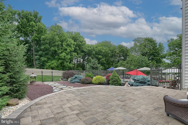 view of patio featuring fence