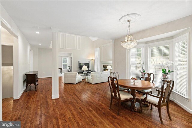 dining room featuring wood finished floors, healthy amount of natural light, and recessed lighting