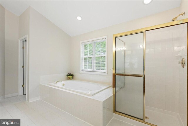 bathroom featuring a bath, a shower stall, tile patterned floors, vaulted ceiling, and recessed lighting