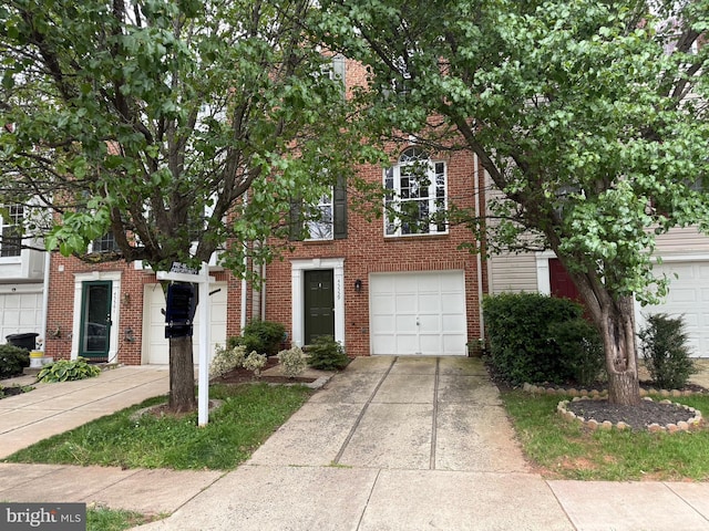 45559 Grand Central Sq, Sterling, VA 20166 - view of front of home featuring brick siding and concrete driveway