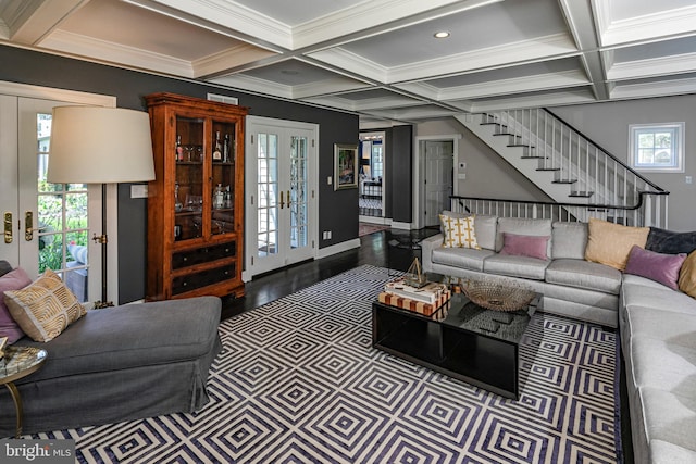 living area with coffered ceiling, beam ceiling, french doors, and stairway