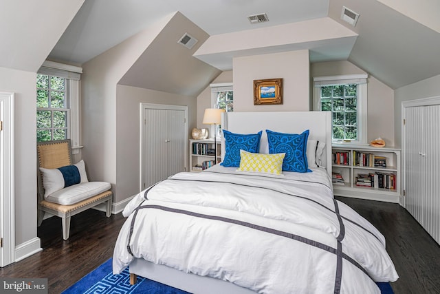bedroom featuring visible vents and wood finished floors