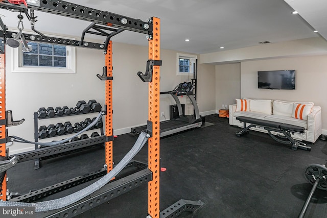 exercise area with visible vents, baseboards, and recessed lighting