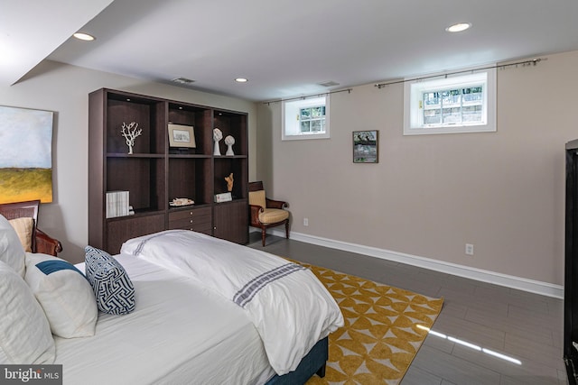 bedroom with baseboards, visible vents, and recessed lighting