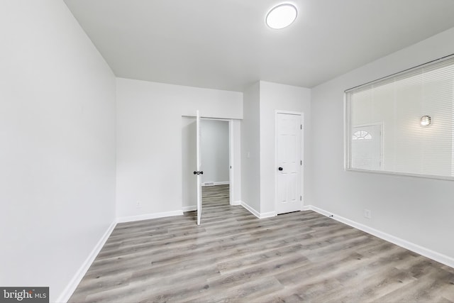 1 Maple Ave, Baltimore, MD 21206 - unfurnished bedroom featuring wood finished floors and baseboards