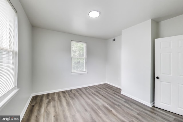 1 Maple Ave, Baltimore, MD 21206 - spare room featuring wood finished floors and baseboards