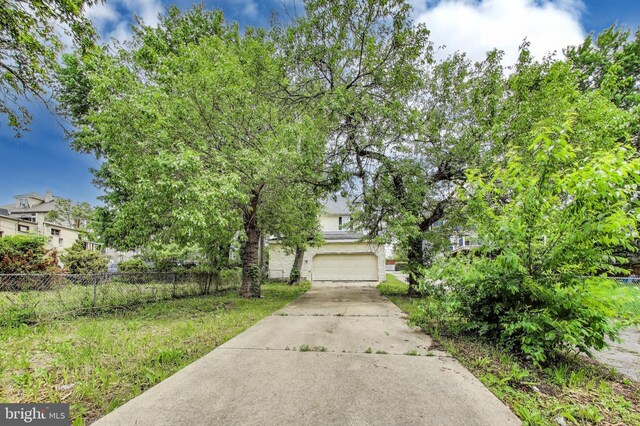 1 Maple Ave, Baltimore, MD 21206 - view of front of house with fence, a garage, and concrete driveway