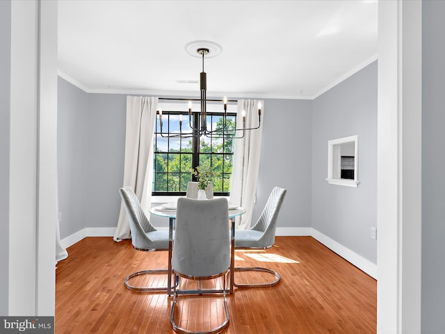1990 Kate Dr, Port Republic, MD 20676 - dining space with baseboards, ornamental molding, a chandelier, and hardwood / wood-style floors