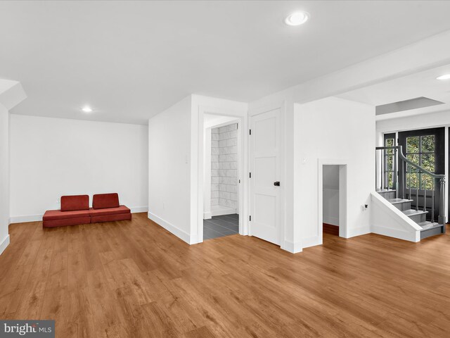 1990 Kate Dr, Port Republic, MD 20676 - basement featuring baseboards, light wood-style flooring, recessed lighting, and stairs