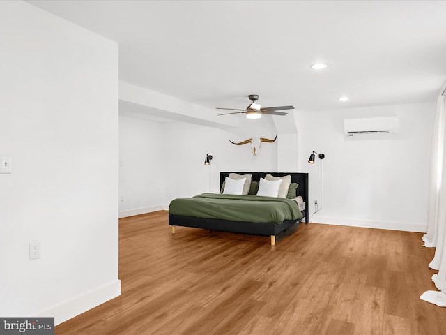 1990 Kate Dr, Port Republic, MD 20676 - bedroom featuring a wall mounted AC, baseboards, light wood finished floors, recessed lighting, and ceiling fan