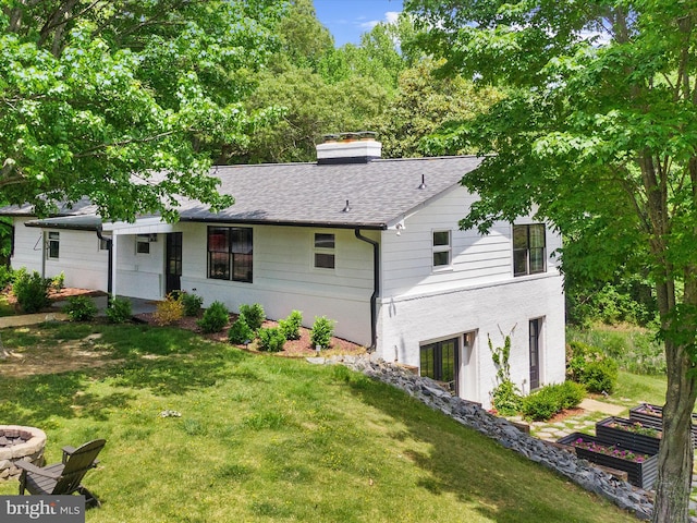 1990 Kate Dr, Port Republic, MD 20676 - rear view of house featuring a yard, a chimney, and roof with shingles