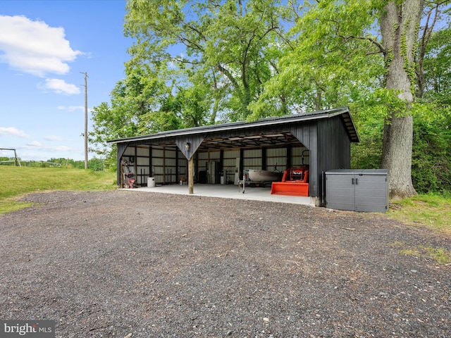 1990 Kate Dr, Port Republic, MD 20676 - view of parking featuring an outbuilding and a carport