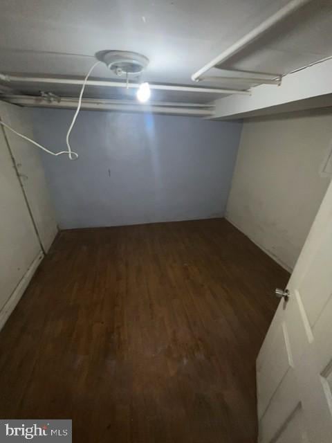 finished below grade area featuring wood finished floors