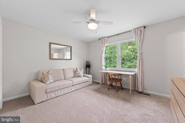 9518 Center St, Vienna, VA 22181 - carpeted living area with a ceiling fan and baseboards