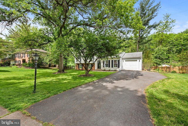 9518 Center St, Vienna, VA 22181 - view of property hidden behind natural elements featuring an attached garage and asphalt driveway