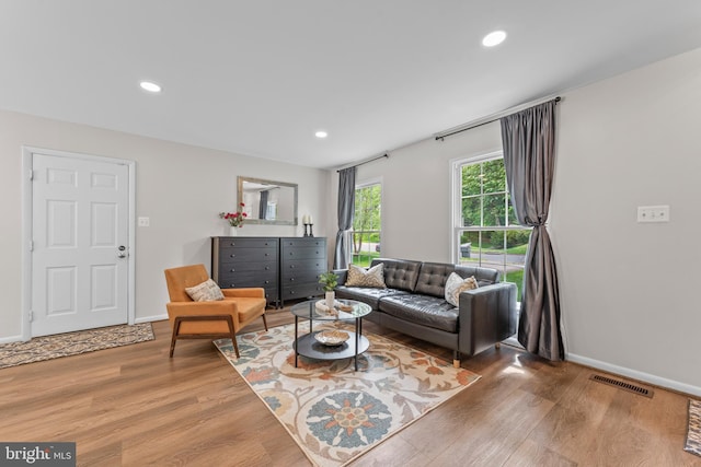 9518 Center St, Vienna, VA 22181 - living area with wood finished floors, baseboards, and recessed lighting