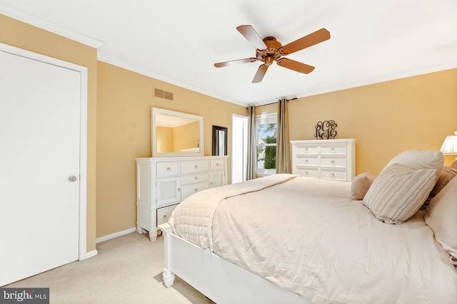 bedroom with light colored carpet, crown molding, baseboards, and a ceiling fan