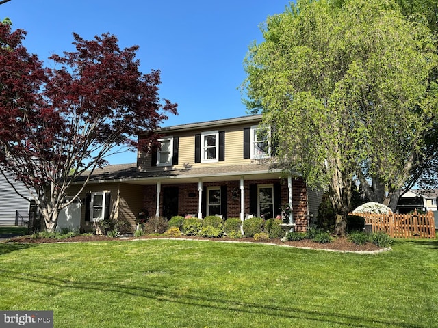 traditional-style house featuring brick siding