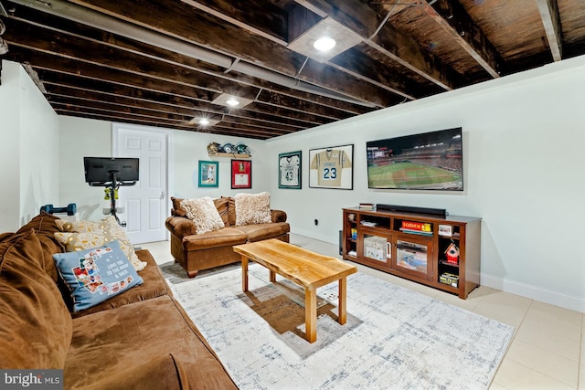 living area featuring tile patterned floors and baseboards