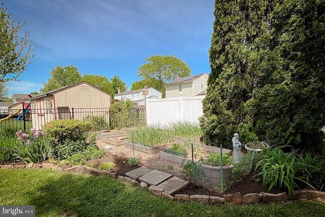 view of yard with a garden and fence