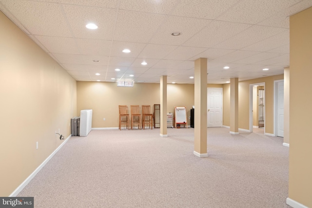finished below grade area with baseboards, a paneled ceiling, recessed lighting, and carpet floors