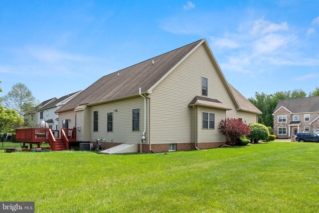46 Stone Run Dr, Mechanicsburg, PA 17050 - rear view of house with a deck, a lawn, and central AC