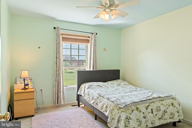 bedroom featuring ceiling fan, carpet floors, and baseboards