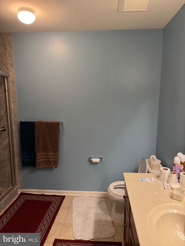 full bathroom featuring tile patterned flooring, toilet, a shower stall, and vanity