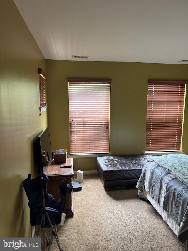 bedroom featuring carpet floors, baseboards, and visible vents