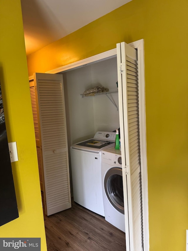 laundry area featuring laundry area, independent washer and dryer, and dark wood-style floors