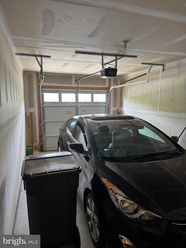 garage featuring a garage door opener