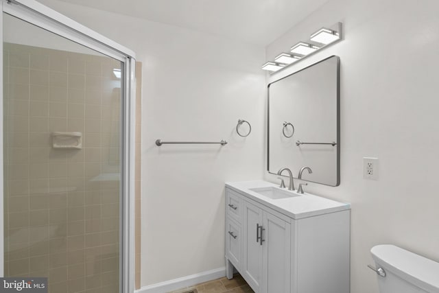 722 S Clinton St, Baltimore, MD 21224 - bathroom featuring toilet, vanity, and a tile shower
