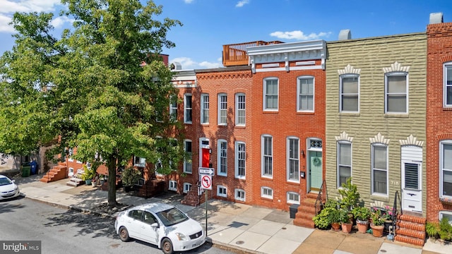 722 S Clinton St, Baltimore, MD 21224 - view of front of house featuring entry steps and brick siding