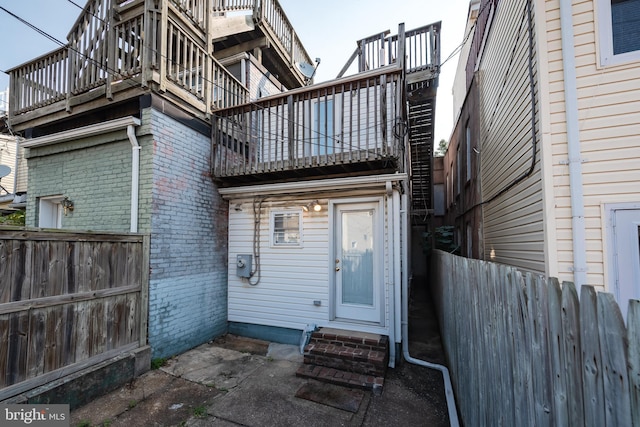 722 S Clinton St, Baltimore, MD 21224 - entrance to property featuring brick siding and a balcony