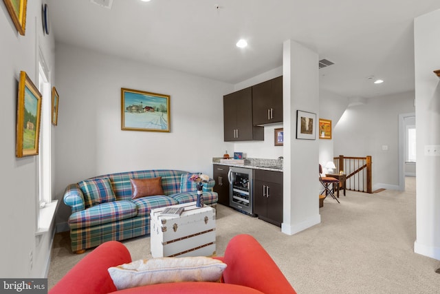 724 E Howell Ave, Alexandria, VA 22301 - living area with wine cooler, bar, light carpet, baseboards, and recessed lighting