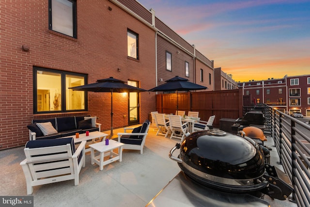 724 E Howell Ave, Alexandria, VA 22301 - patio terrace at dusk with an outdoor hangout area and outdoor dining space