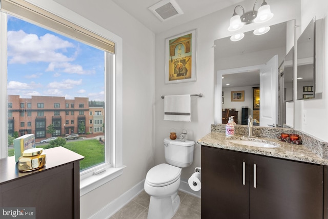 724 E Howell Ave, Alexandria, VA 22301 - bathroom with vanity, toilet, tile patterned floors, and baseboards