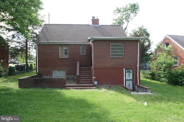 5205 58th Ave, Hyattsville, MD 20781 - back of property featuring a chimney, a yard, brick siding, and stairs