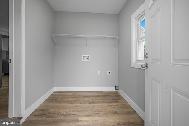 laundry room with wood finished floors, laundry area, electric dryer hookup, baseboards, and hookup for a washing machine