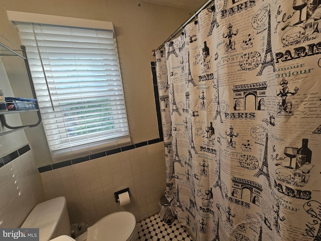 9 47th St SE, Washington, DC 20019 - full bathroom with tile walls, curtained shower, and wainscoting