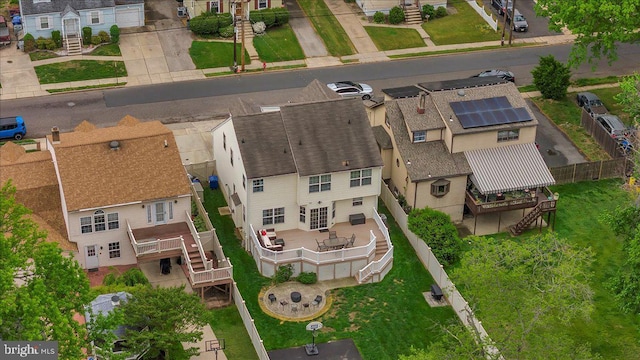 birds eye view of property with a residential view