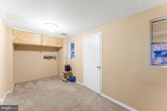 7703 Huron Dr, Gainesville, VA 20155 - laundry area featuring light colored carpet and baseboards