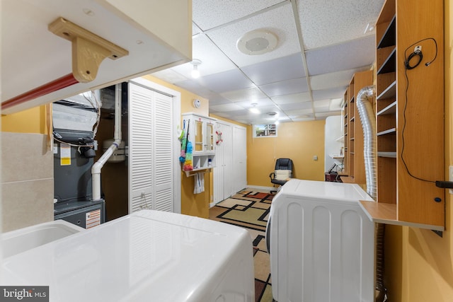 7703 Huron Dr, Gainesville, VA 20155 - interior space featuring washer and clothes dryer, a paneled ceiling, and baseboards