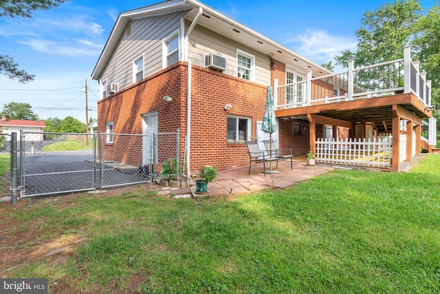 7703 Huron Dr, Gainesville, VA 20155 - back of house featuring a gate, brick siding, a patio, a deck, and cooling unit