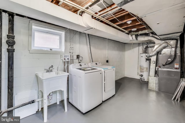 2505 Oxon Run Dr, Temple Hills, MD 20748 - laundry room with gas water heater, independent washer and dryer, and concrete block wall