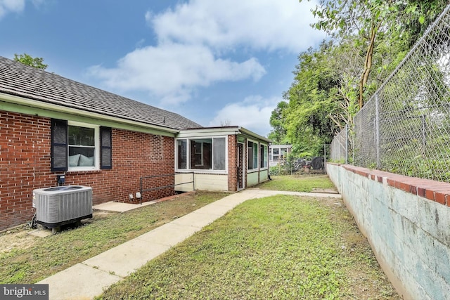 2505 Oxon Run Dr, Temple Hills, MD 20748 - view of yard featuring cooling unit and a sunroom
