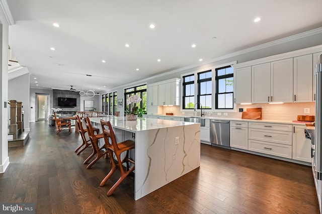 3015 Friends Rd, Annapolis, MD 21401 - kitchen featuring dishwasher, crown molding, light stone counters, open floor plan, and recessed lighting